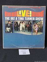 Front cover of the vinyl LP 'Live! The Ike & Tina Turner Show' featuring Ike & Tina Turner and band images on blue background with yellow and white text.
