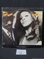 Front cover of Ike & Tina Turner's Greatest Hits vinyl LP album showing a black and white photograph of the artists with yellow text.