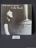 Front cover of the vinyl LP showing a black and white photo of a woman in profile, titled ...But the Little Girls Understand by The Knack.