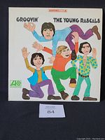 Front cover of the vinyl LP titled 'Groovin'' by The Young Rascals showing cartoon illustration of band members.