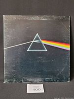 Front cover of Pink Floyd The Dark Side of the Moon vinyl LP with iconic prism and rainbow design.