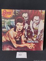 Front cover of David Bowie Diamond Dogs vinyl LP showing Bowie artwork on gatefold sleeve.