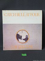 Front cover of the vinyl LP album 'Catch Bull At Four' by Cat Stevens, showing design and title.