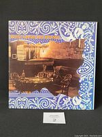 Front of the vinyl LP gatefold cover showing design with vintage bar scene and colorful decorative border.