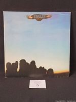 Front cover of the Eagles vinyl LP showing the group silhouette and the artist logo.