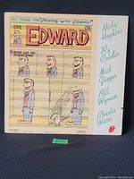 Front cover of 'The Edward' vinyl LP sleeve showing comic strip style cartoon character Edward and artist names in handwriting style on right side.