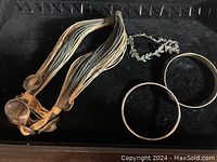 Image showing heavy sterling silver multi-strand necklace components and two silver bracelets.