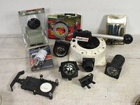 Full lot showing Rule hand pump, gauges, compass, pin striping kit, and mounts