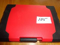Top view of the closed red toolbox showing the rectangular shape and black trim edges, with a white label '105' on top.