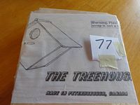 Image showing cardboard box labeled 'The Treehouse' featuring a simple line drawing of the bird house design on the front and warning about plastic wrap.