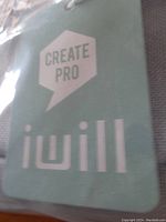 Close-up photo of iwill brand tag on storage box fabric showing 'iwill' and 'Create Pro'.