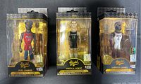 Three Funko Gold NBA figures in original boxes: Joel Embiid, Nikola Jokic, LeBron James
