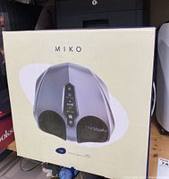 Front of boxed Miko Y8 foot massager showing branding and device image