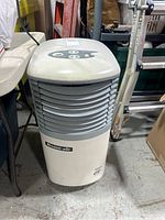 Front view of Roadair portable air conditioner showing vented louvers and brand label.