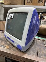 Side view showing blue translucent plastic casing and curved integrated screen