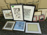 Group photo of 8 assorted framed art pieces including signed bird print, architecture prints, abstract print, and an empty frame with white mat.