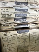 Fold-out automobile specifications with A.E.A. Tune-Up System bars and multiple vehicle specification tabs from 1940s-1960s.