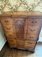Full frontal view of the Victorian highboy dresser showing drawer arrangement and wood finish.