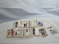Stacks of assorted 1991 7th Inning Stretch OHL hockey cards spread out, showing many player cards face up.