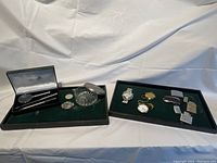 Overall lot display showing all items arranged in three trays against a white backdrop.