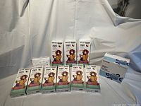 Boxes of N95 FNPL certified respirator masks for kids, size small, featuring child and adult wearing masks, arranged on surface.