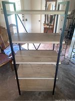 Front view of the 5 shelf display unit showing five wood veneer shelves and black metal frame.