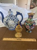 All three items side by side on beige surface with Westcott ruler laid in front.