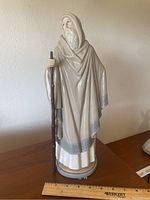 Full view of Lladro shepherd porcelain sculpture showing entire figure with staff and cloak.