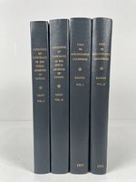Photo showing four hardcover reference books with dark gray cloth covers and gold embossed titles on spine. Titles include two volumes of 'Catalogue of Pamphlets in the Public Archives of Canada' by Casey and two volumes of 'Essai de Bibliographie Canadienne' by Gagnon, published 1895 and 1913.