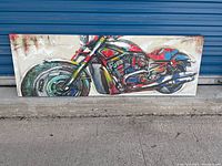 Front view of the entire motorcycle canvas artwork, showing a colorful motorcycle abstract painting on a beige background.
