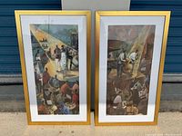 Pair of framed art prints standing side by side, featuring scenes with people and golden frames with white matting.