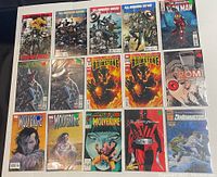 Top-down image of all 15 comics, showing front covers. Titles include All-Winners Squad Band of Heroes, multiple Brimstone #1 covers, ROM #1, Wolverine issues, The Phantom Devil, and Shadowmasters.
