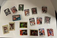 Wide view of all vintage hockey rookie cards laid out on a flat surface including cards featuring Wayne Gretzky and the 1991 Young Superstars box