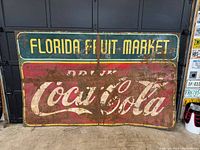 Front view showing ‘FLORIDA FRUIT MARKET’ header and ‘Drink Coca-Cola’ logo with wear patterns