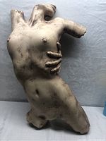 Full frontal view of torso sculpture showing overall form and finish.