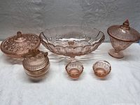 Full lot of six pieces showing large scalloped bowl center, two large lidded footed bowls behind, and two small dessert bowls in front