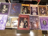 Overview of various royal-themed books and magazines laid out, showing diverse covers related to British monarchs and ceremonies.