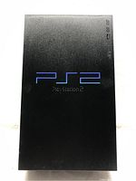 Top view of Sony PlayStation 2 console showing large blue PS2 logo on black matte finish.