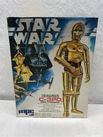 Front of original MPC Star Wars C-3PO 10 inch scale model kit box featuring artwork of C-3PO and Darth Vader