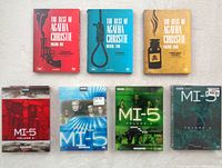 All eight DVD box sets arranged on a surface showing full covers for identification.