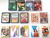 Top view of all DVD boxed sets laid out in organized rows showing front cover art and titles