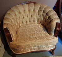 Front angled view of the Victorian tub chair showing deep button tufting and carved wood arms.