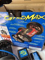 Photo of CyberMaxx remote control car box showing car image with branding and features.