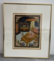 Photo of the framed miniature erotic painting showing the couple on a bed inside an ornately decorated room with star-patterned night sky visible in the background.