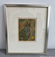Full view of framed Japanese reduction woodblock print with geometric bird design against white wall.