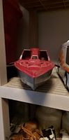 Front view of the GI Joe boat shell showing red and black coloration, cockpit, and upper hull details.