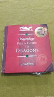 Front cover of the Dragonology Field Guide to Dragons showing title and design.