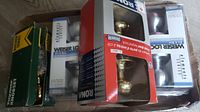 Boxed door knob sets including Weiser and Kwikset brands showing packaging and knobs in original boxes