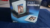 Box front showing set of 4 glass photo coasters with holder, brand Cherished Accents, new in box.