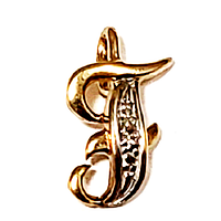 Close-up front view of the pendant showing the yellow gold and white gold textured letter T design.